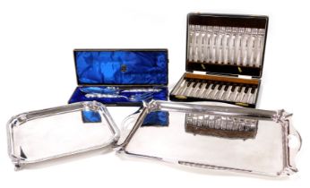 A group of plated wares, a pair of Scottish fish servers, in a case marked for Johnston and Company