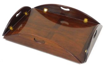 A Georgian style mahogany butlers tray, of shaped rectangular form, with curved handles, 14cm high,