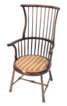 A West Country style stick back high back Windsor style chair, with a shaped cresting rail and scrol