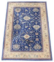 A Royal Kashan Agra pattern blue ground rug, 196cm x 140cm.