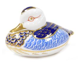 A Royal Crown Derby Imari porcelain duck paperwork, in blue and gold, gold stopper.