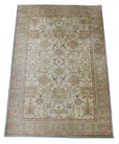 An Abbey Ashbourne pattern cream ground rug, 190cm x 133cm.
