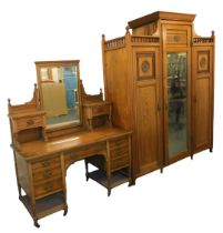 A late Victorian aesthetic movement light ash wardrobe compactum and dressing table by Shapland & Pe