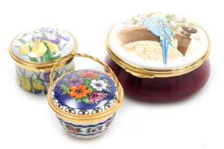 Two Staffordshire enamel boxes, one decorated with a budgerigar, the other with irises, together wit