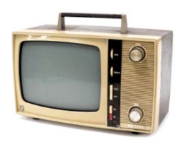 A Philips vintage portable television, in a mushroom coloured plastic and faux skin casing, 38cm wid