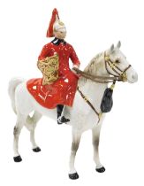 A Beswick pottery figure of a Lifeguard, mounted on a dappled grey horse, model number 1624, printed