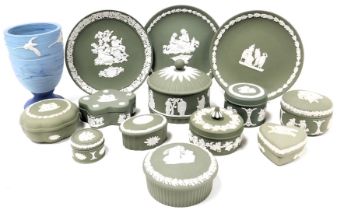 A group of Wedgwood green Jasperware, including variously shaped trinket boxes and covers, and three