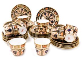 Twelve Royal Crown Derby Imari porcelain tea cups, saucers and plates, pattern no. 1128, printed and