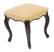 A Victorian rosewood stool, upholstered in cream coloured fabric, raised on cabriole legs, 40cm wide