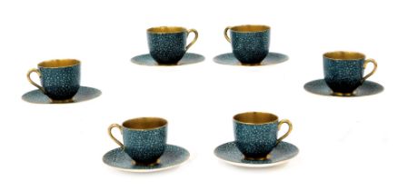 A set of six early 20thC Royal Worcester porcelain demi-tasse coffee cups and saucers, decorated in