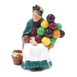 A Royal Doulton figure modelled as the Old Balloon Seller, HN1315.