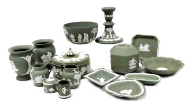 A group of Wedgwood green Jasperware, including a hexagonal money box, bowl, vases, dressing table b