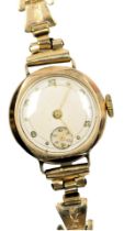 A mid century 9ct gold cased lady's wristwatch, circular silvered dial bearing Arabic numerals at ev