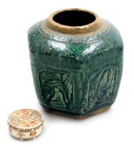 An early 20thC Chinese green Shiwan pottery ginger jar, of hexagonal form, decorated with panels of