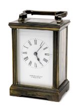 A Garrard & Company brass carriage clock, the rectangular dial bearing Roman numerals, single barrel