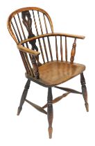 A 19thC Lincolnshire ash and elm low back Windsor chair, with shaped back, plain spindles, C shaped