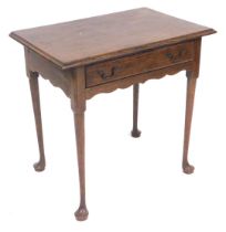 An early 19thC and later oak lowboy, the moulded top raised above a frieze drawer, on turned legs, t