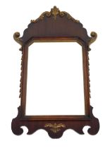 A Georgian style mahogany and gilt wood wall mirror, carved with hairbells and foliate scrolls, inse