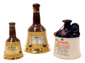 A Grant's Deluxe Scotch Whisky, in a two tone pottery bottle with stopper, together with a Bells Spe