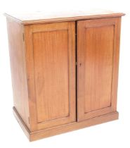 A Victorian mahogany cupboard, with plain rectangular top, and two cupboard doors, on a plinth base,