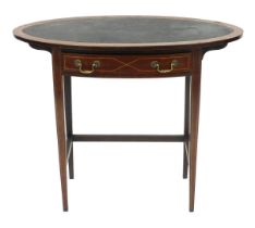 An Edwardian oval mahogany occasional table, with leather top, bow fronted frieze drawer, raised on