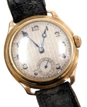 A mid-Century lady's 9ct gold cased wristwatch, circular silvered dial with engine turned decoration