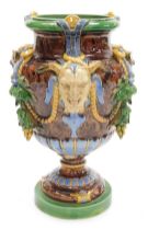 A late 19thC Minton majolica vase, of baluster form, moulded with Bacchanalian masks, vines and rope