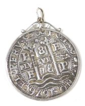 A Bolivian Carlos II 8 reales silver coin, in a pendant mount, stamped silver.