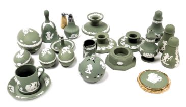 A group of Wedgwood green Jasperware, including a pair of Scotch candlesticks, a ring tree, condimen