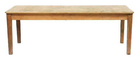 A Victorian pine plank top kitchen table, raised on tapering square legs, 76cm high, 218.5cm wide, 7