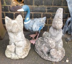 Garden ornaments, comprising reconstituted stone rabbit figure group, foxes and a metal duck. (3)