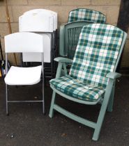 Garden chairs, comprising a set of six white finished garden chairs and two cushioned green plastic