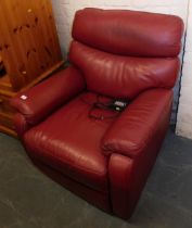A red faux leather reclining armchair.