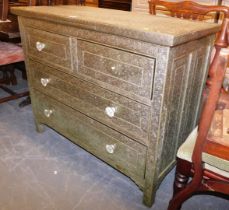 An Eastern style chest of drawers, with inset silver coloured panels, heavily embossed with flowers,