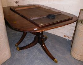 A mahogany extending dining table in Regency style, with one additional leaf, 210cm wide.