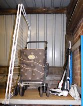 A Sholley shopping trolley, Goblin cordless vacuum cleaner, Powerbrush cordless vacuum cleaner and a