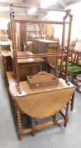 A 19thC oak drop leaf table, mahogany towel rail and a carrying trundle. (3)