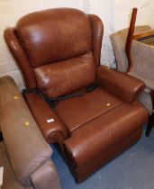 A Sherborne brown leather reclining armchair.