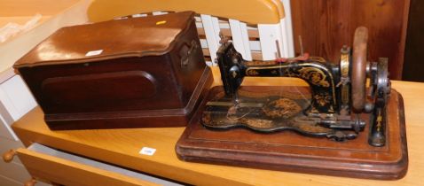 A Rossmann and Co manual sewing machine, in walnut case.