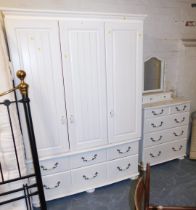 White finish bedroom furniture, comprising triple wardrobe above an arrangement of six drawers, ches