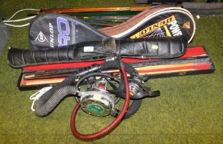 A quantity of sporting equipment, including fishing rods and reels, tennis rackets, snooker cues and