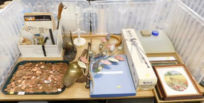 A small magazine rack, watch, tray containing a quantity of copper and small silver coins, a newspap