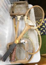 Five vintage tennis rackets.