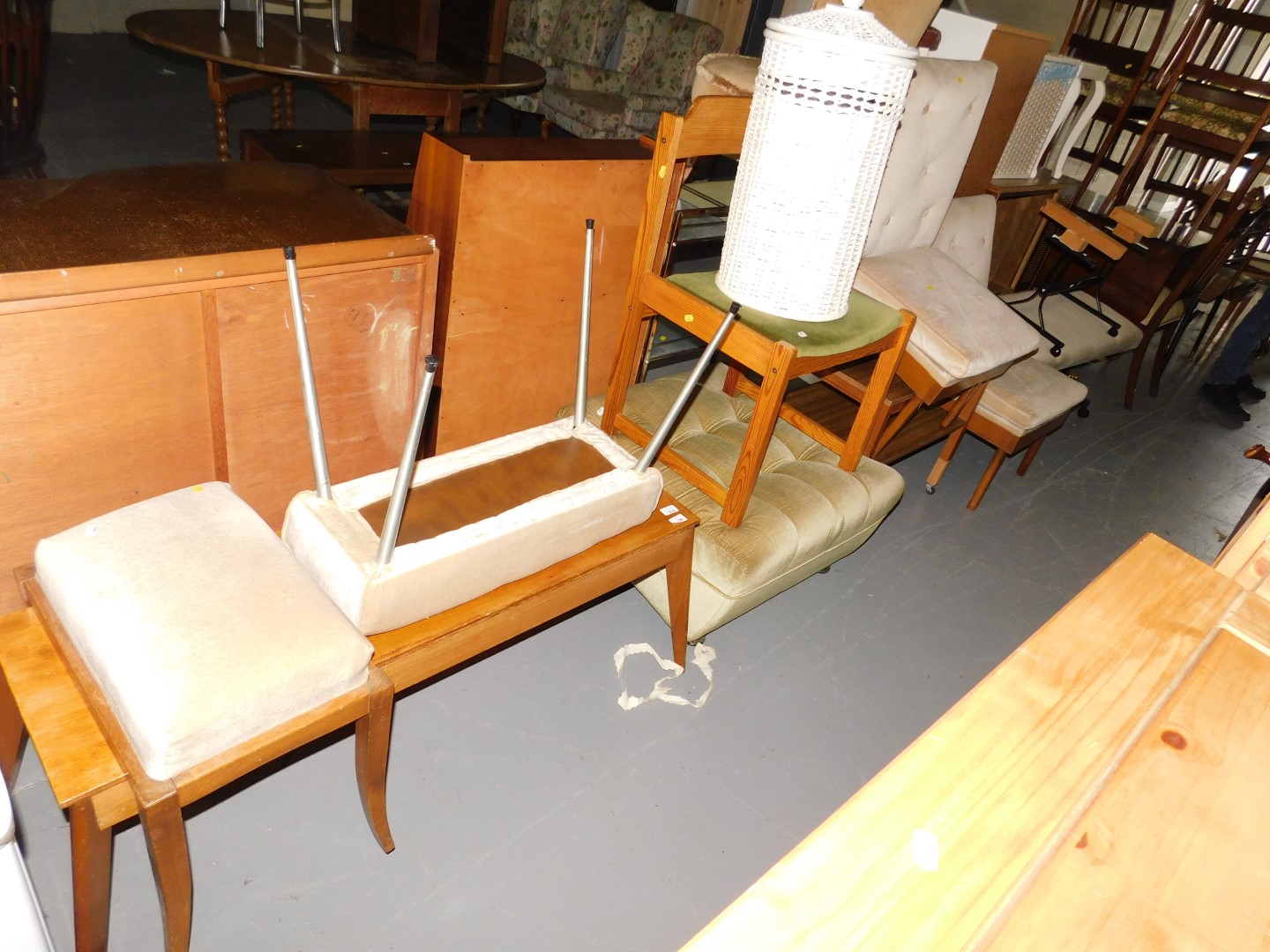 Assorted furniture, including a coffee table, small upholstered stool, wicker basket, a single chair