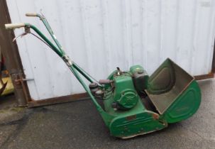 A Ransom's green push along petrol lawn mower.