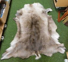 A reindeer skin rug.