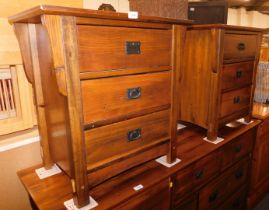 A pair of hardwood three drawer bedside chests.