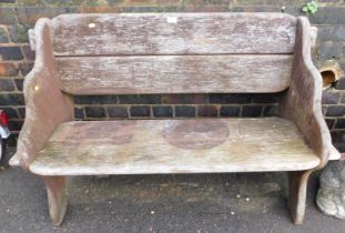 A wooden slatted garden bench.