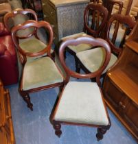 A harlequin set of five 19thC mahogany cloud back dining chairs with drop in seats.