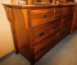 A hardwood sideboard, with an arrangement of three short and four long drawers.